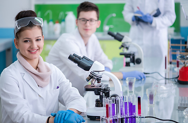 Image showing Group of young medical students doing research