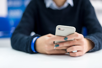 Image showing female student using a mobile phone