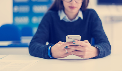 Image showing female student using a mobile phone