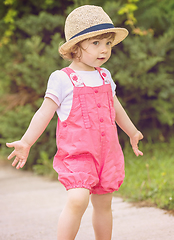 Image showing little girl runing in the summer Park