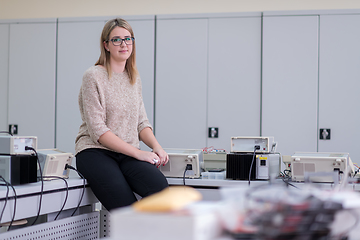 Image showing female student sitting on the table