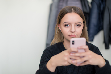 Image showing female student using a mobile phone