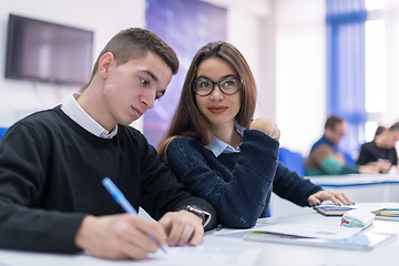 Image showing young students writing notes