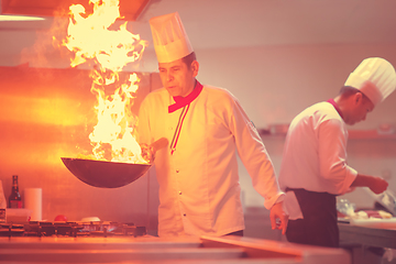 Image showing Chef doing flambe on food