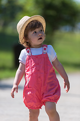 Image showing little girl runing in the summer Park