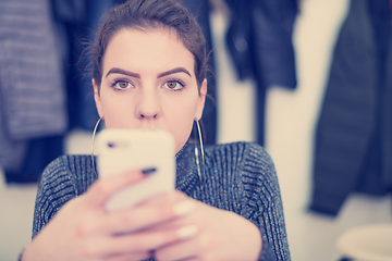 Image showing female student using a mobile phone