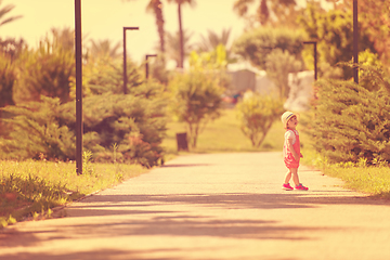 Image showing little girl runing in the summer Park