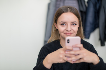 Image showing female student using a mobile phone
