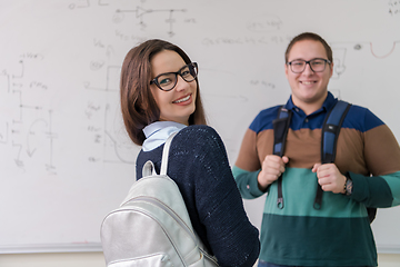 Image showing portrait of young students in front of chalkboard