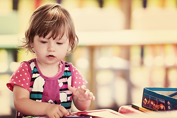 Image showing little girl drawing a colorful pictures