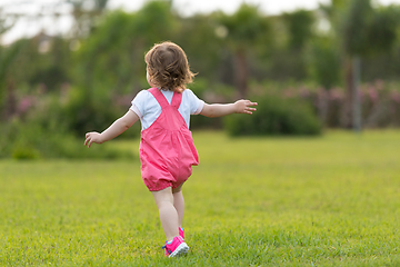 Image showing little girl spending time at backyard