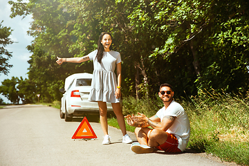 Image showing Young couple traveling on the car in sunny day