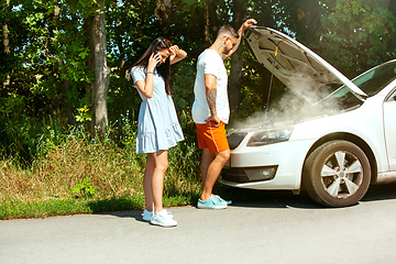 Image showing Young couple traveling on the car in sunny day