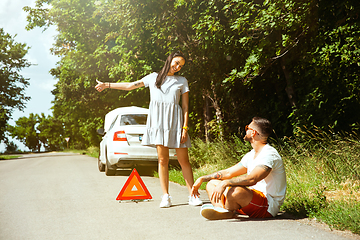 Image showing Young couple traveling on the car in sunny day