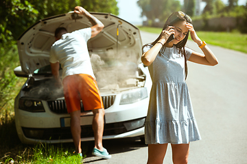 Image showing Young couple traveling on the car in sunny day