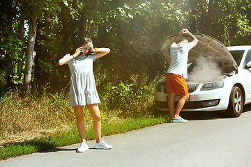 Image showing Young couple traveling on the car in sunny day