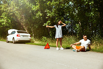 Image showing Young couple traveling on the car in sunny day