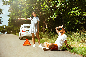 Image showing Young couple traveling on the car in sunny day