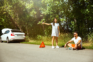 Image showing Young couple traveling on the car in sunny day