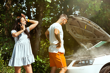 Image showing Young couple traveling on the car in sunny day