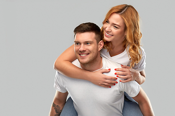 Image showing happy couple in white t-shirts having fun