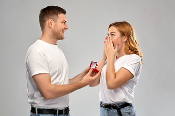 Image showing man giving woman engagement ring on valentines day