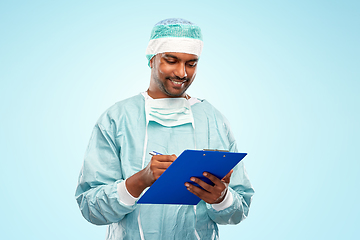 Image showing indian male doctor or surgeon with clipboard
