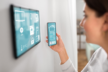 Image showing woman using tablet computer and smartphone