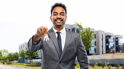 Image showing indian man realtor with keys on city street