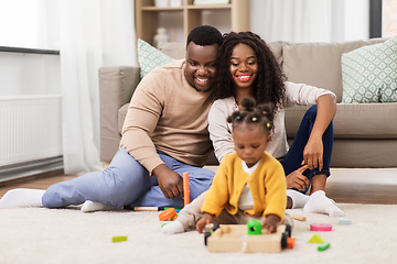 Image showing african family playing with baby daughter at home