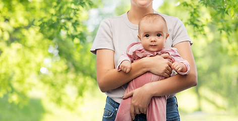 Image showing happy young mother holding little baby daughter