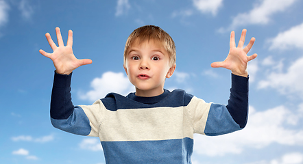 Image showing little boy playing over blue sky