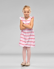 Image showing displeased little girl with crossed arms pouting