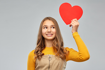 Image showing smiling teenage girl with red heart