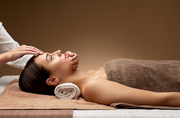 Image showing woman having face and head massage at spa