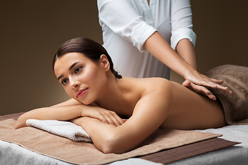 Image showing woman lying and having back massage at spa