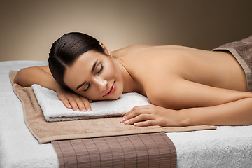 Image showing young woman lying at spa or massage parlor