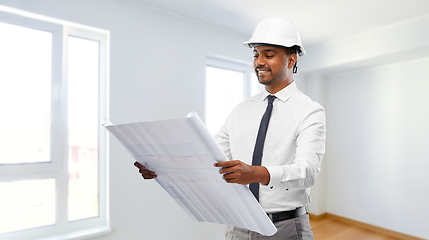 Image showing indian male architect in helmet with blueprint