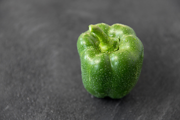 Image showing close up of green pepper on slate stone background