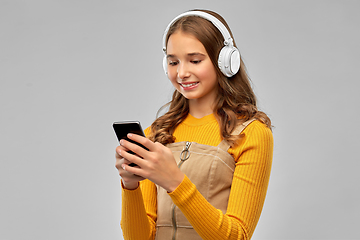 Image showing teenage girl in headphones listening to music