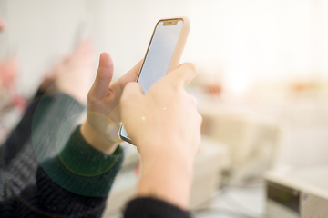 Image showing female student using a mobile phone