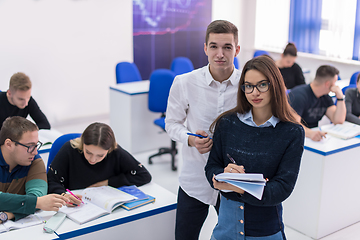 Image showing young students writing notes