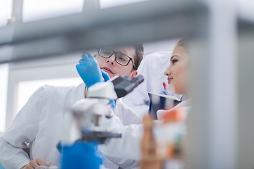 Image showing Group of young medical students doing research