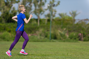 Image showing young female runner training for marathon