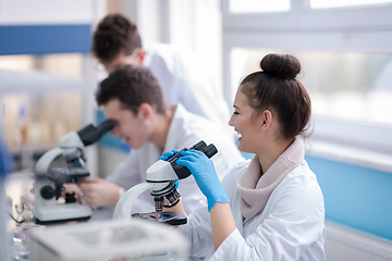 Image showing Group of young medical students doing research