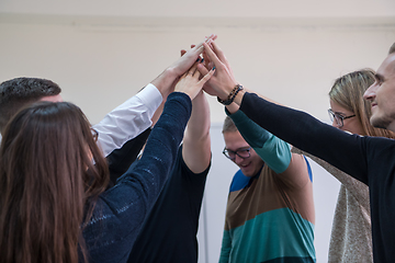 Image showing students celebrating successfully finished project