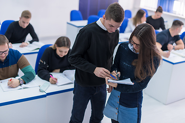 Image showing young students writing notes