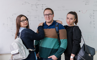 Image showing portrait of young students in front of chalkboard