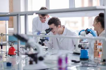 Image showing Group of young medical students doing research