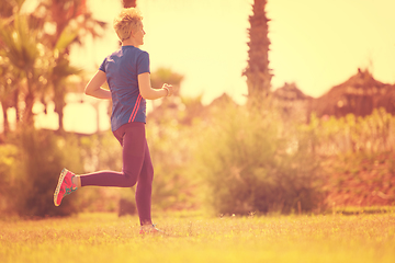 Image showing young female runner training for marathon